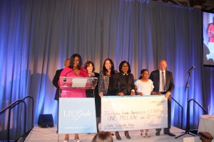 Love Sessoms and Soulful Heart representatives present check to LIU. 