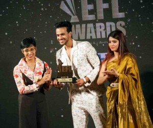 Mohit Kumar receiving the award from Mrs. Santi Das, and Mrs Suvagata Saha