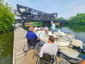 Ken Carwell (left) and Dave Hanson (right) oversee the inaugural boat launch