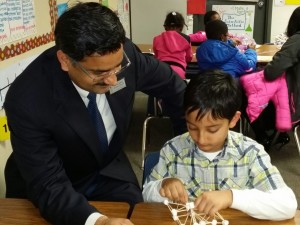 Dr Bipul Singh in a school with a kid