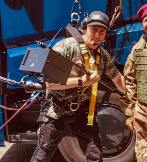 Ferdi Fischer on the Set of Fast X, holding a WarpCam® prototype