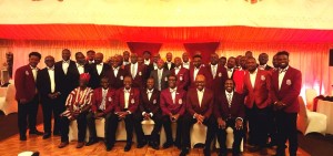 Giants pose for a group photograph after the fundraising dinner