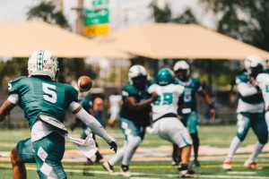 Karon Johnson throws a pass to JAACC Wide Receiver Jamal Bryant #5