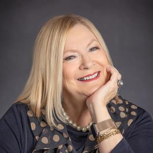Ginger Wassum, Recognized by BestAgents.us as a 2023 Top Agent.