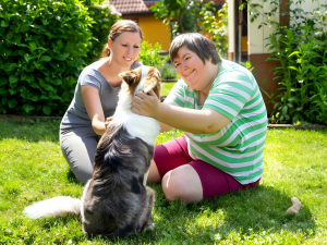NDIS Disability Support Worker with His NDIS Participant Playing With Dog