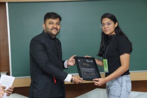 Author receiving memento from the organizers