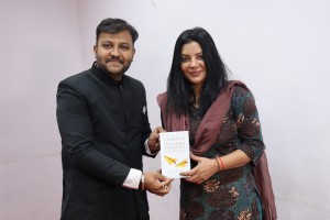 Gifting the book to Shraddha Sharma, CEO, Your Story