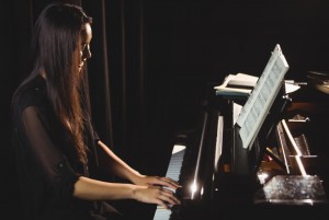 woman playing piano music studio 1