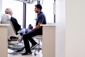 Dental hygienist assisting ClearBraces patient to the 3 D X ray unit at Dentistry By The Bay Barrie 