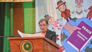 Mohagher Iqbal Minister of Basic, Higher, and Technical Education delivering a commemorative speech
