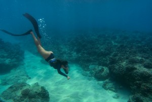 woman freediving with flippers underwater 23 2148976488