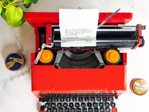 1969 Olivetti Valentine Typewriter with a custom typewriter print by Typecraft Goods