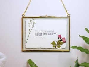 Framed custom typewriter print with pressed flowers by Typecraft Goods