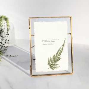 Framed custom typewriter print with pressed leaves by Typecraft Goods