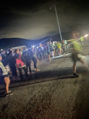 Ragnar racers stand in front of Mending Minds Village booth.