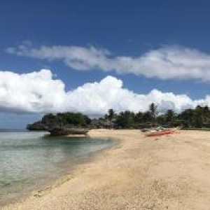 Beach with boat in distance