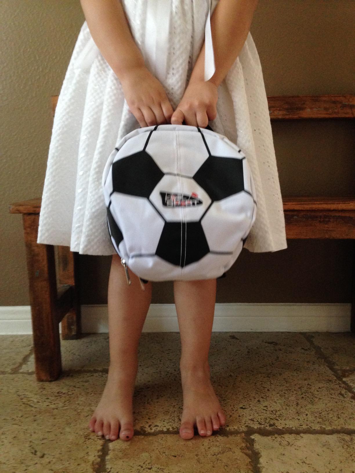 A Little girl enjoying here sport pack A Little girl enjoying here sport pack
