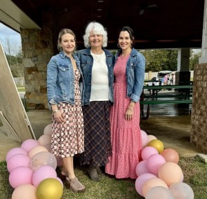 Author Paulette C. Hammack with her daughters during the reveal party of her great-granddaughter