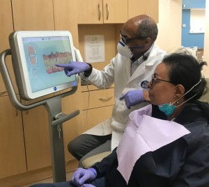 Washington DC dentist Dr Daniel Hines explaining dental crown options at Premier Dental Care