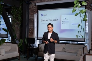 Dileep Dhakal delivering a keynote presentation, sharing the journey of Veel.