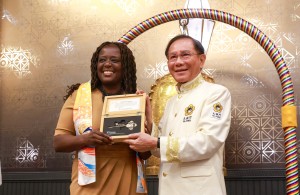 New York State Senator Cordell Cleare is presented with the 