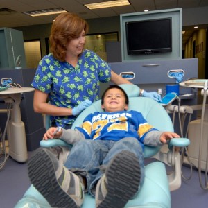 Dr Nicola Hill Cordell with her pediatric patient at ABC Dentistry Orthodontics
