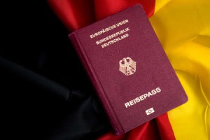 138487952 german passport on flag of federal republic of germany