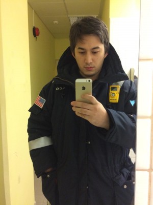 Ulykbek Talipbekov in a safety suit at Tengizchevroil factory