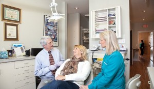 Wilmington dentist Dr James Gainer with dental implants patient at Wrightsville Dental