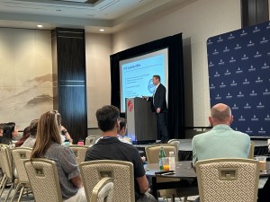 Avi Weisfogel presents at a Freedom Dental Partners live event in 2024. 