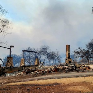 Jaime Gomez surveys fire damage to his Altadena home