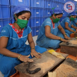 Hand rolling the Incense