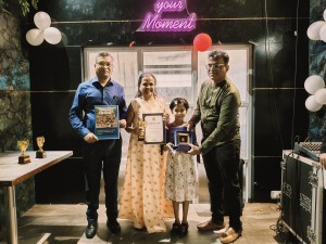 Mahi receiving trophy and certificate
