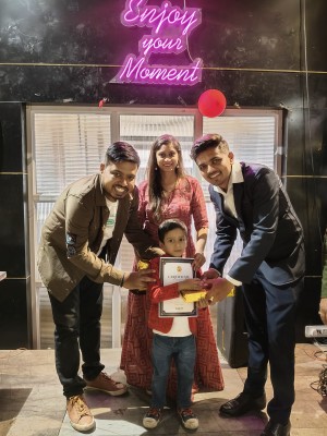 Niraag receiving trophy and certificate