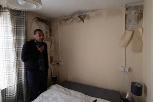 AA1Aqu3a Errol Baptiste poses for photos in his house in West London Britain