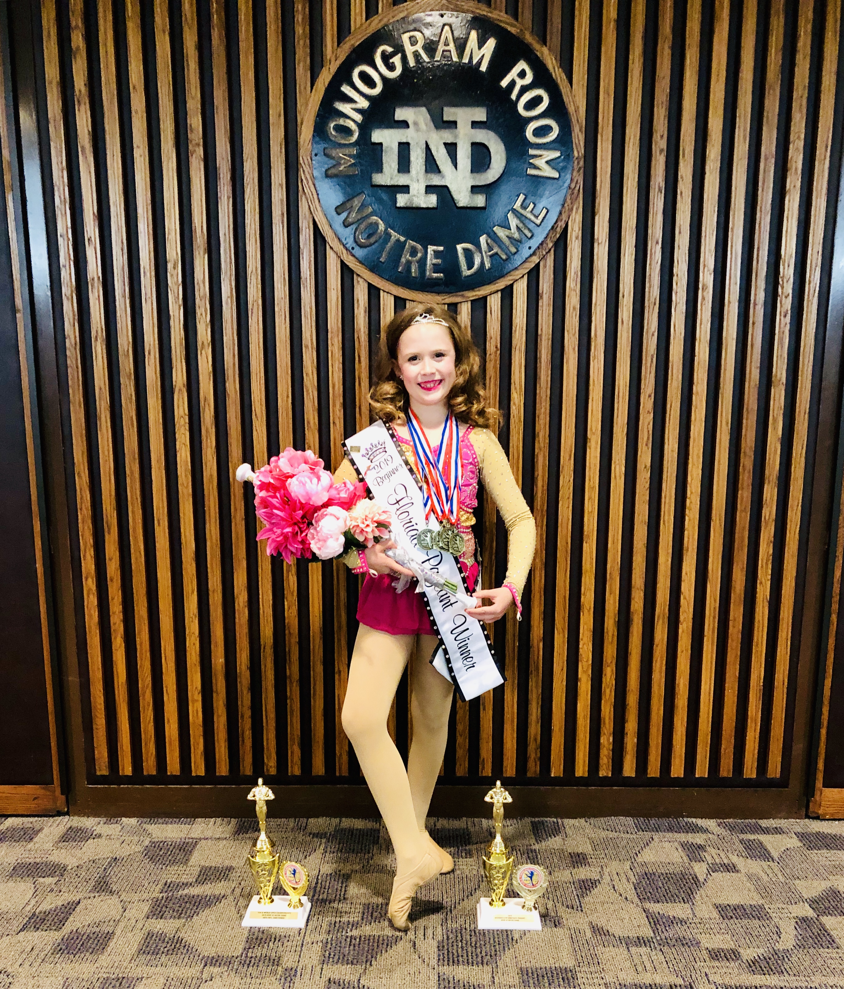 Jocelyn Foran represents Florida in the 2019 National Juvenile Beginner Pageant and displays awards won during her week of competition at AYOP