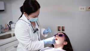 Alexandria dentist Dr Irene Shin working on dental implants