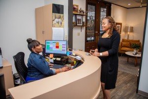 Warm and friendly front desk staff at Mills Dental Group