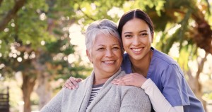 Caregiver outside with senior
