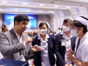 Collaboration: Engineer and nurses review implant.