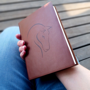Leather notebook with a horse line art design - crafted for those who cherish the equestrian life.