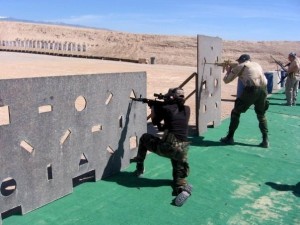 Nicky Dare training with military and law enforcement during a live rifle exercise