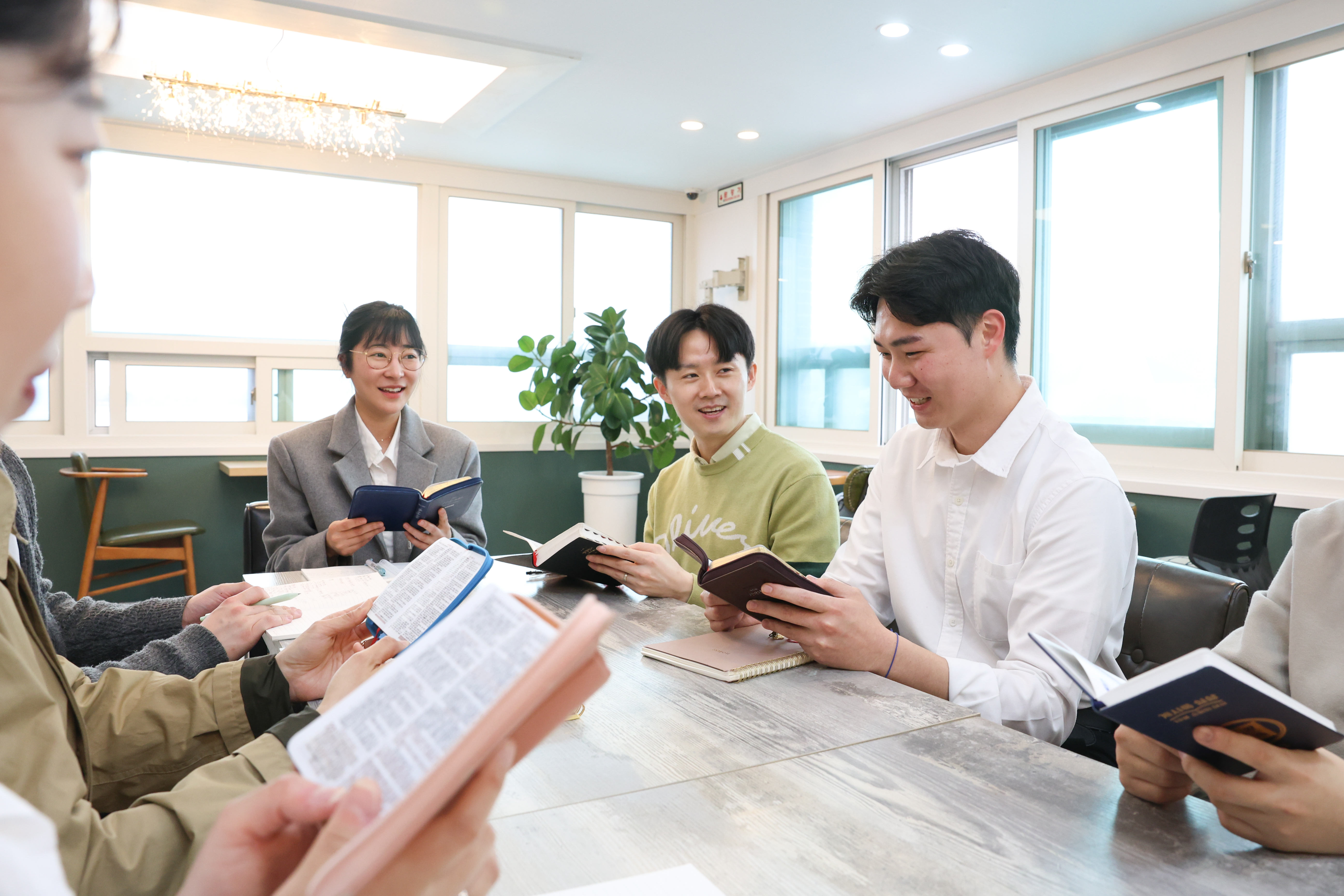 Shincheonji Church of Jesus members study the Bible together before the sealing exam