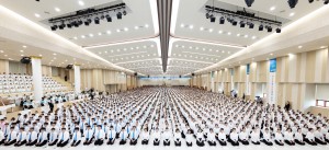 Shincheonji Church of Jesus members receive test papers to take the sealing verification exam.