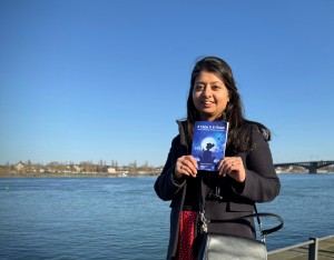 Author Menorca Chaturvedi with her book