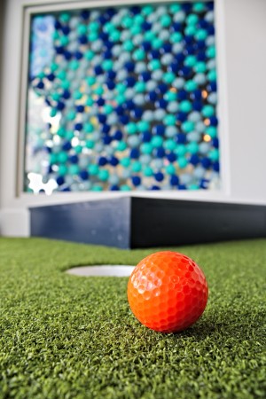 Play the 2 custom designed indoor mini golf courses