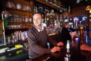 Chris Pondoff at the bar where he once drank, now sharing stories of recovery.