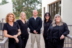 Scottsdale dentist Dr Alex Martin DDS with his team outside his office