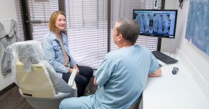 Scottsdale dentist Dr Alex Martin explaining dental implants procedure to patient