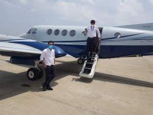 Dr. Amit Magare with the captain, returning after a successful patient transfer.